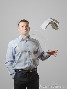 young-man-throws-book-over-his-head-white-background-53026102